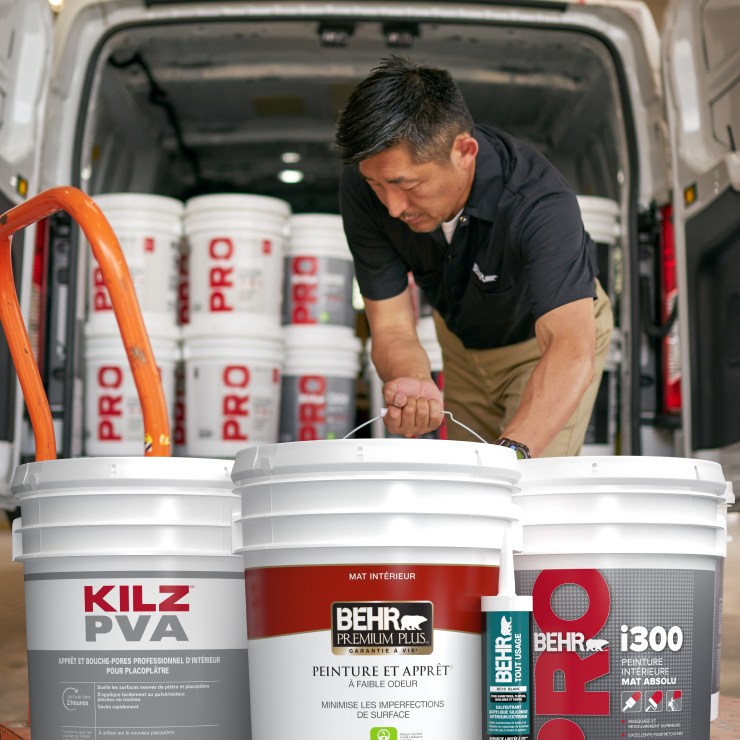 Rep loading truck with Behr products