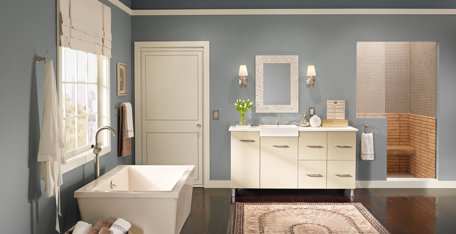 Relax styled bathroom with blue-gray walls and white trim.