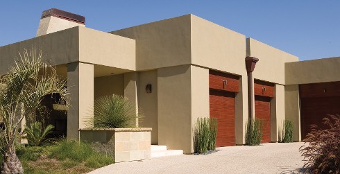Modern themed house with light brown walls, and dark brown trim.