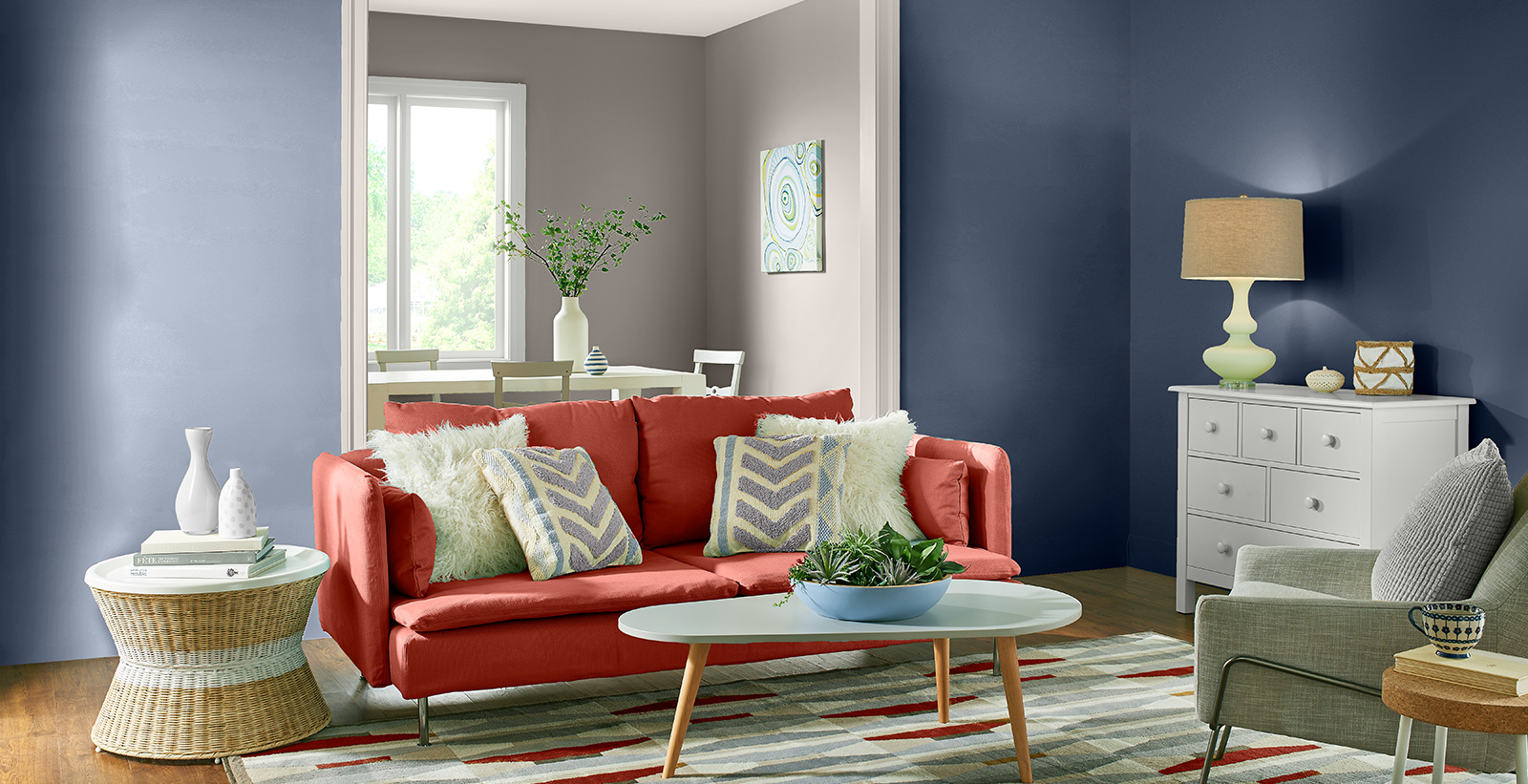 Mid-century living room with blue on walls, white on trim, and red couch