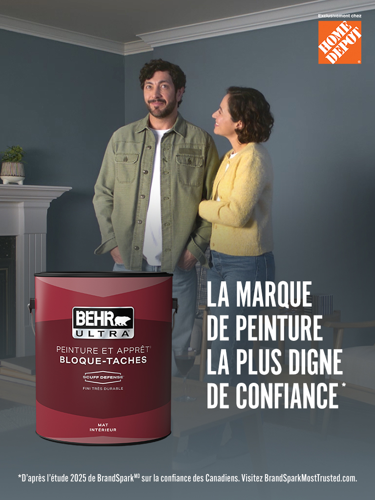 Mobile-sized image of a couple looking at their freshly painted wall