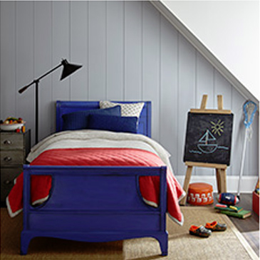 Kid's bedroom with blue bed and red comforter