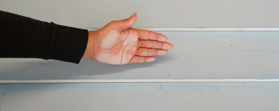 Hand checking chalkiness of painted wall, pass 8