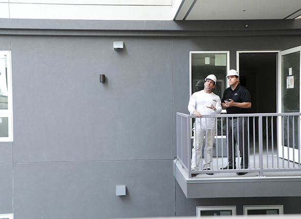 Contractors on balcony