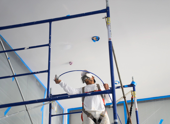 Painter painting ceiling