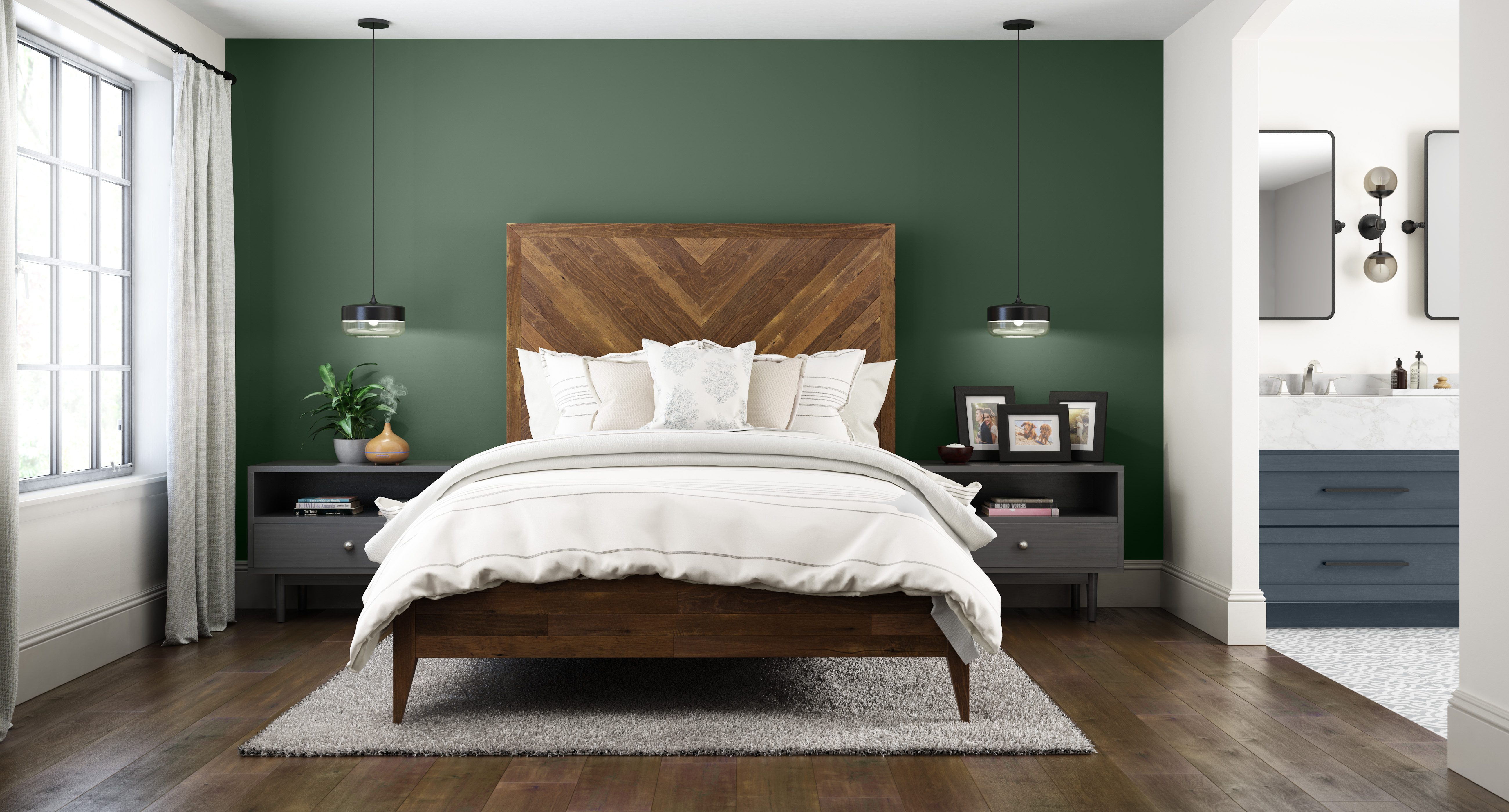 Une chambre blanche avec un mur d'accent peint dans une couleur de vert profond.