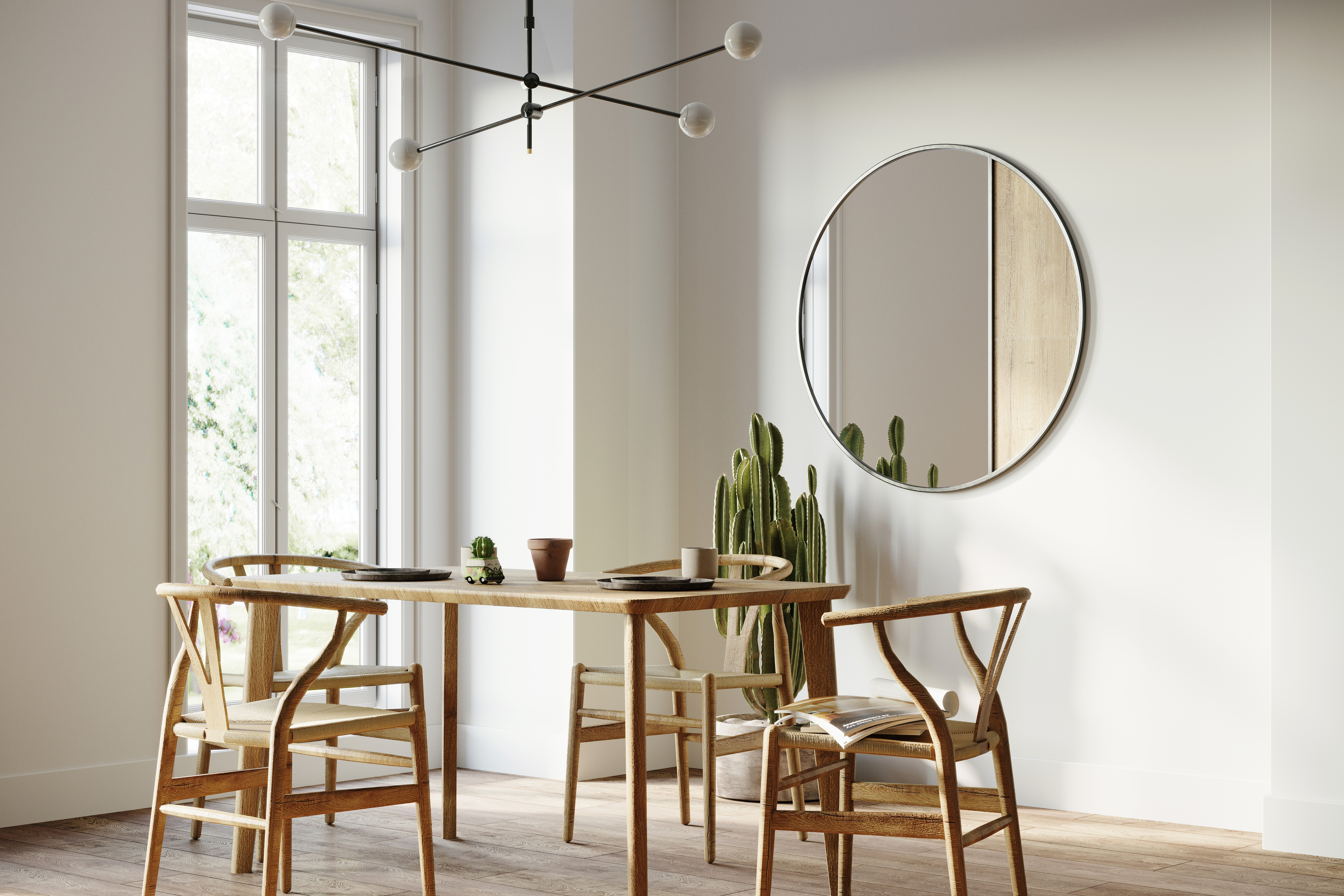 Une salle à manger moderne aux murs peints en blanc, stylisée avec une table et chaises minimalistes, un miroir rond et un luminaire simple