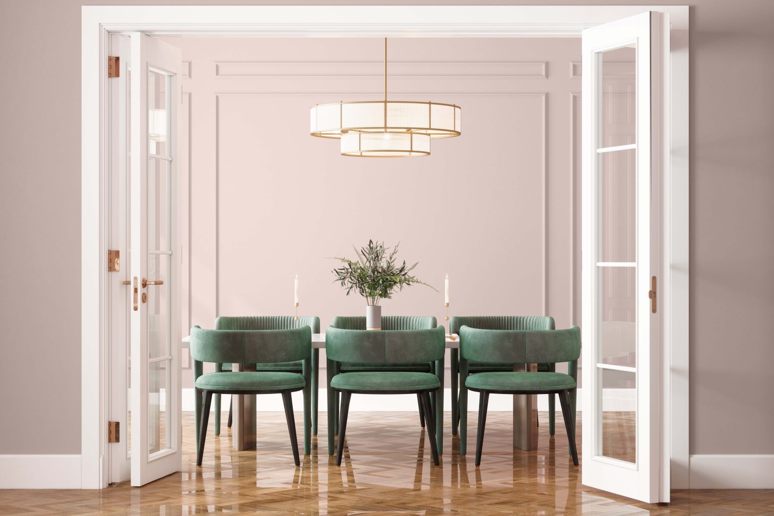 The entrance of an elegant dining room, with walls painted in a neutral light pink colour and styled with a white dining table and green velvet dining chairs