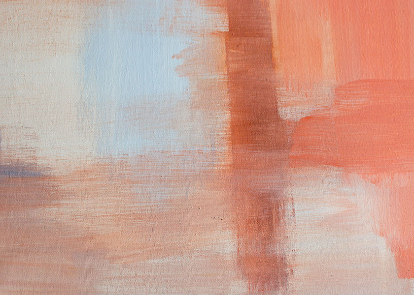 A canvas with an abstract drawing using colors that are both muted and bright orange hues. There are also slight touches of a blue hue representing a sky and nature reflecting on a body of water.